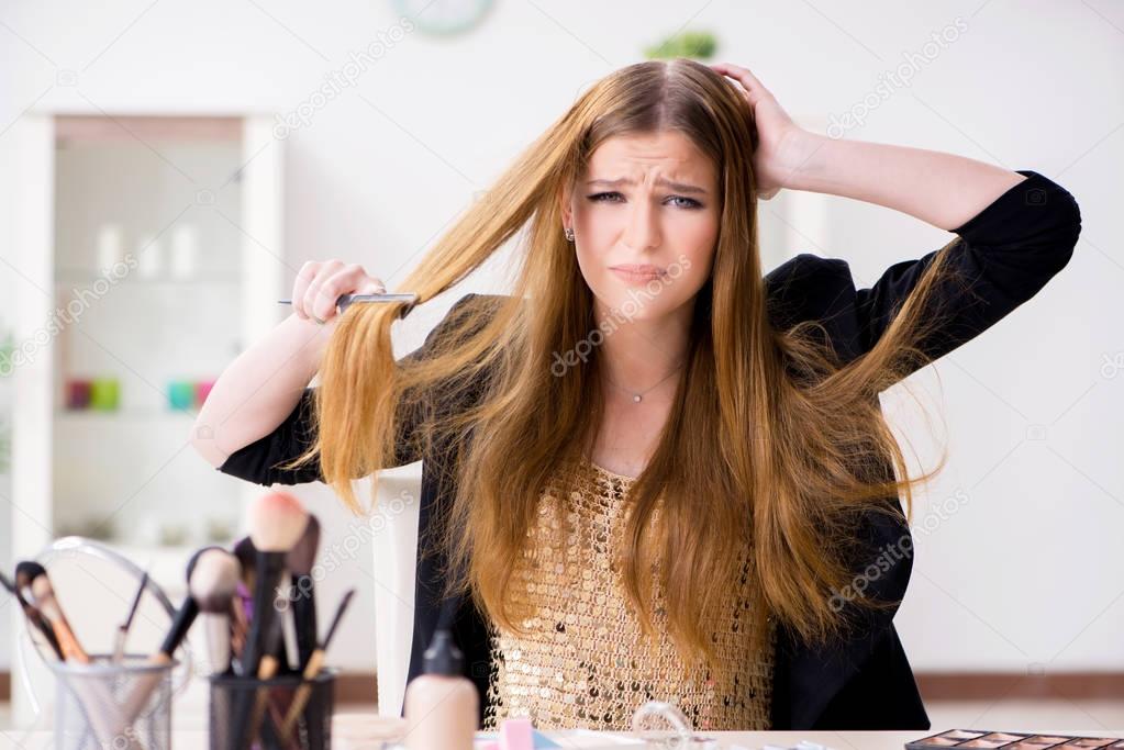 Young woman frustrated at her messy hair