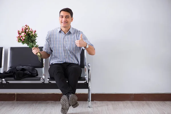 Happy dad waiting for news in maternity house