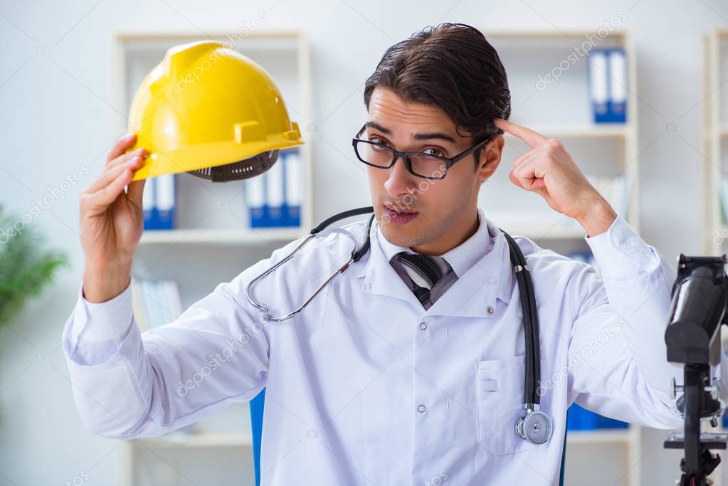 Safety doctor advising about wearing hard hat