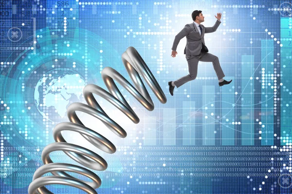 Businessman jumping from spring in promotion concept — Stock Photo, Image