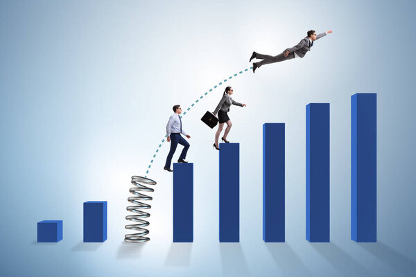 Business people jumping over bar charts