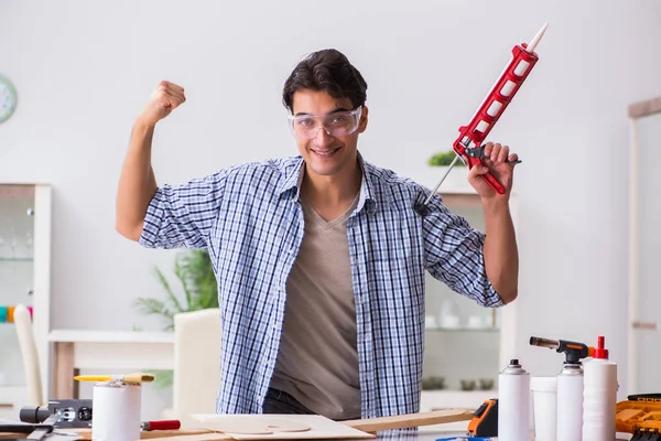 Young man in woodworking hobby concept — Stock Photo, Image