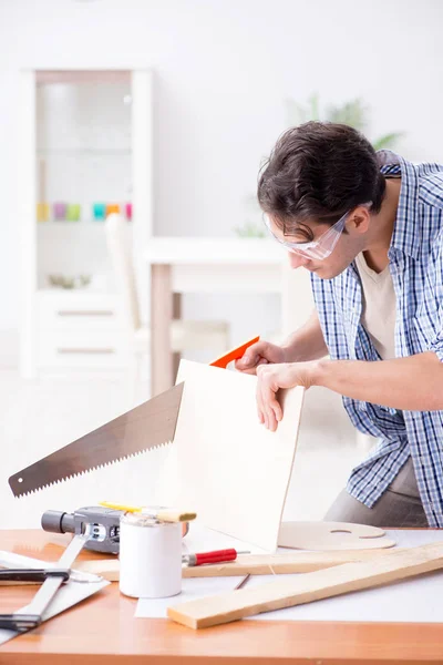 Young man in woodworking hobby concept — Stock Photo, Image