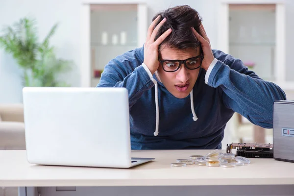 Young man mining bitcoins at home — Stock Photo, Image