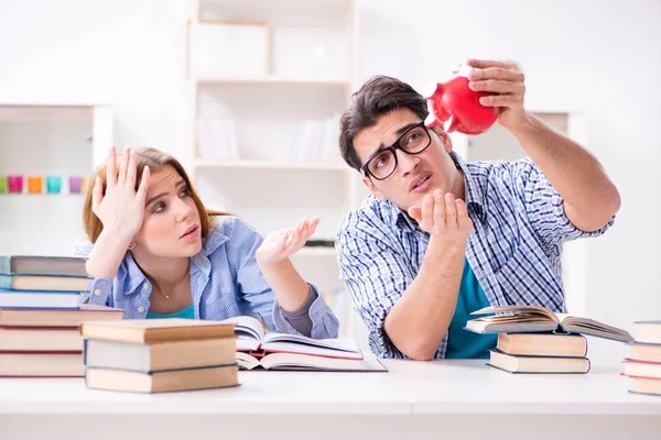 Two students checking savings to pay for education — Stock Photo, Image