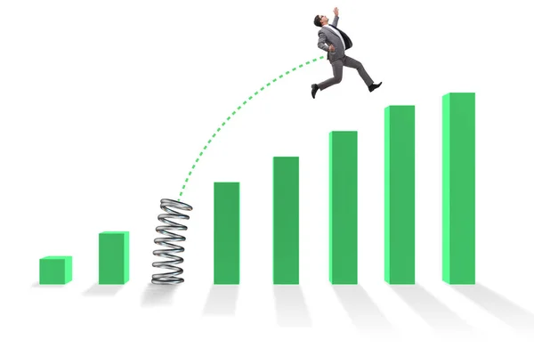 Business people jumping over bar charts — Stock Photo, Image