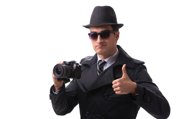 Spy with camera taking pictures isolated on white — Stock Photo, Image