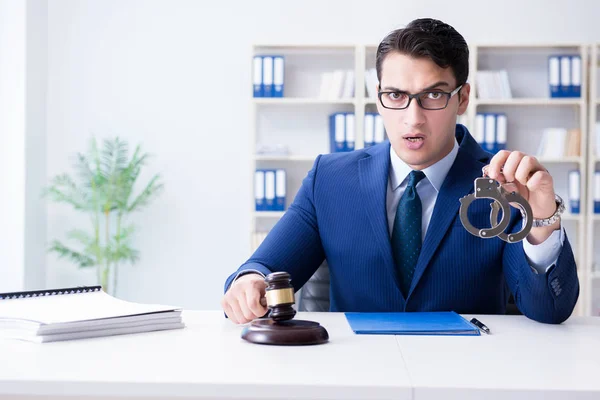 Young lawyer judge sitting in the office