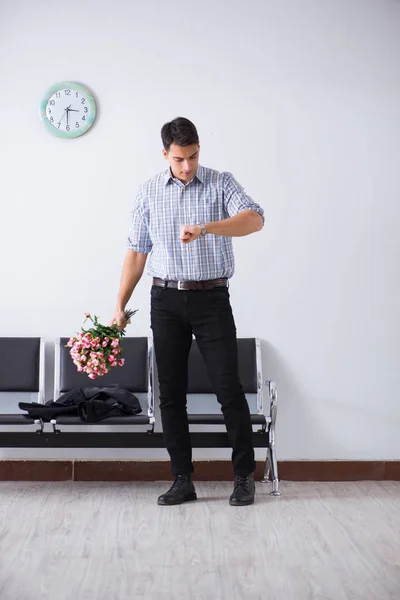 Happy dad waiting for news in maternity house