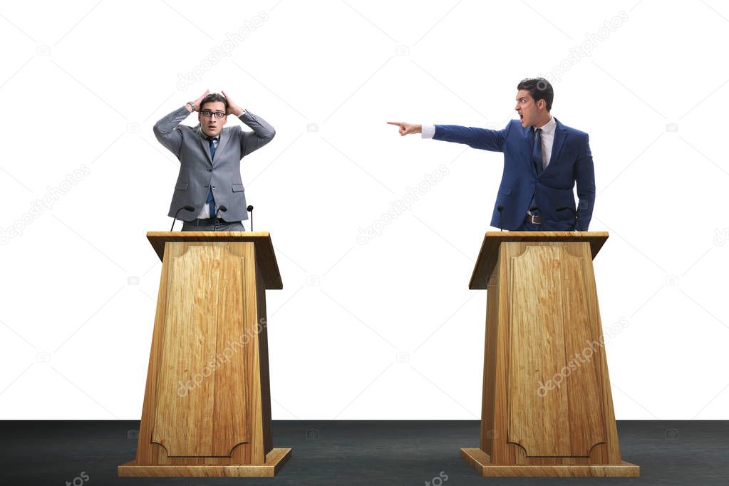 Two businessmen having heated discussion at panel discussion