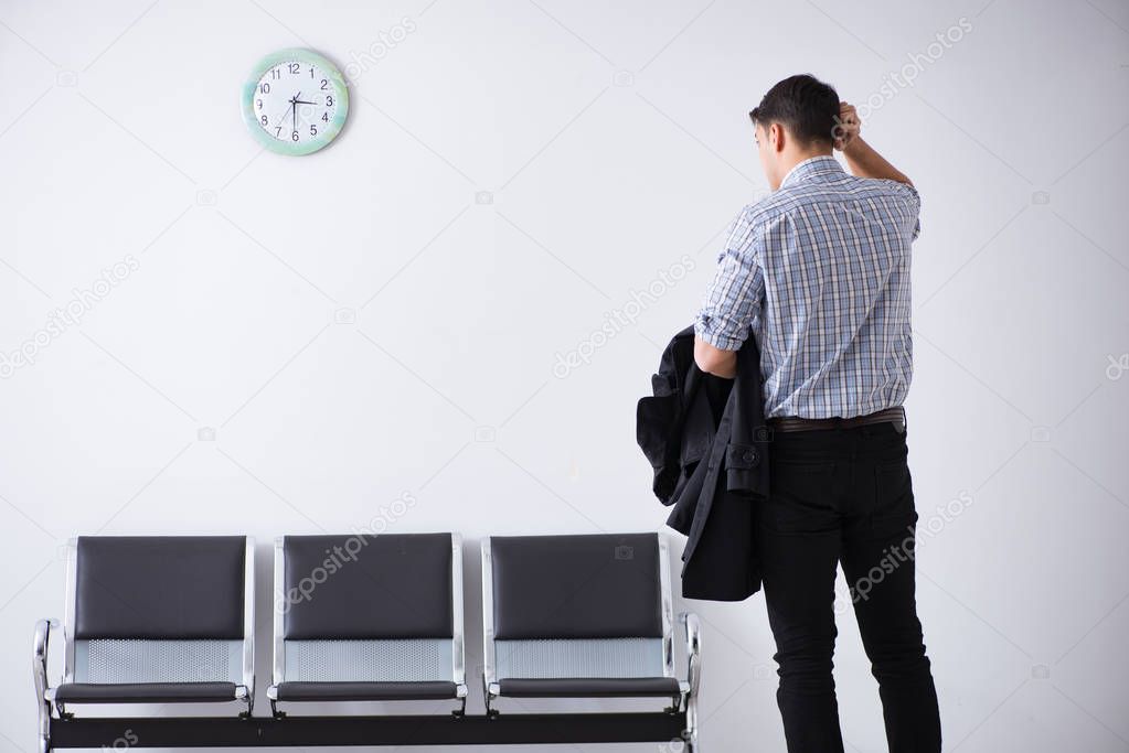 Man nervously impatiently waiting in the lobby