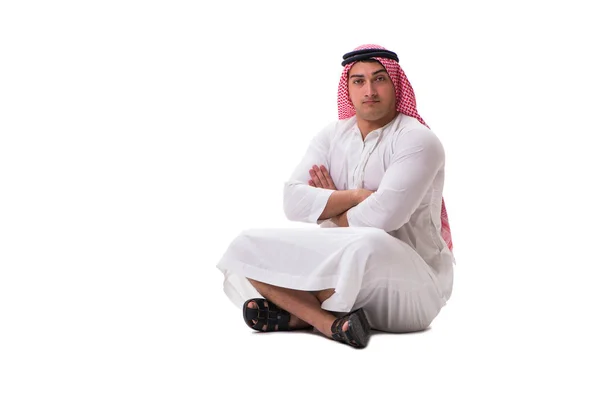 Hombre árabe joven sentado aislado en blanco — Foto de Stock
