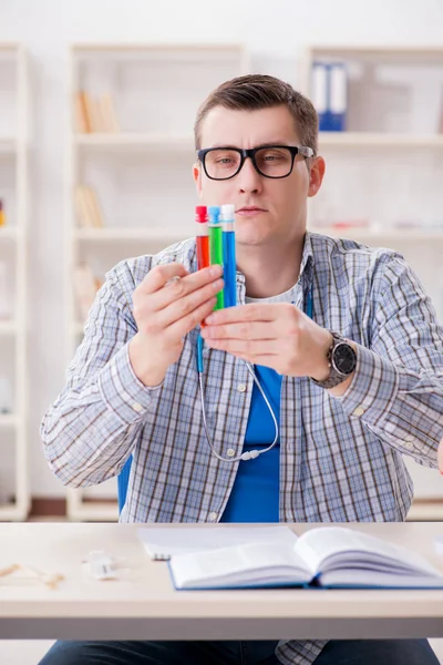 Young student studying chemistry in university — Stock Photo, Image