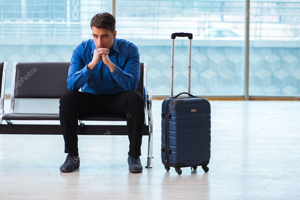 Man wairing to boarding in airport lounge room