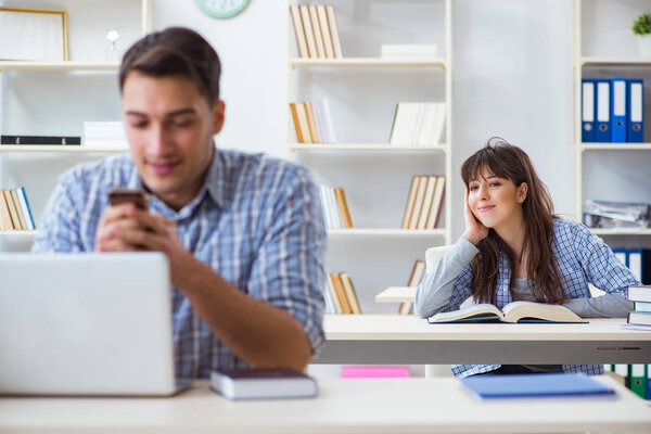 Students sitting and studying in classroom college