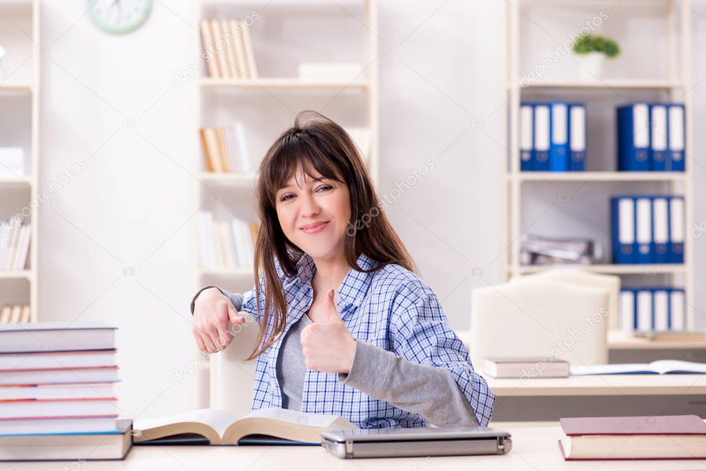 Young female student in educational concept