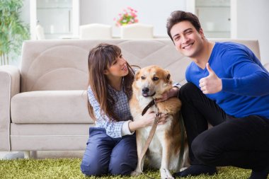 Happy family with golden retriever dog clipart