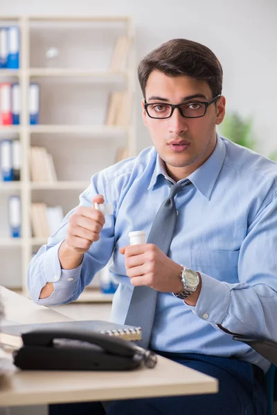 Extremely busy businessman working in office