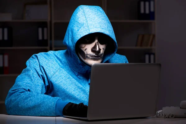 Scary hacker hacking security firewall late in office — Stock Photo, Image