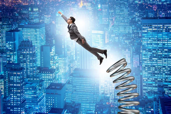 Businessman jumping from spring in promotion concept — Stock Photo, Image