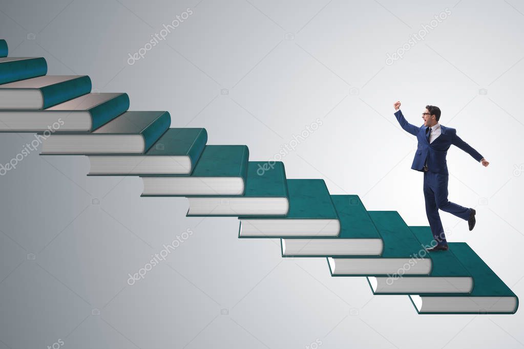 Businessman student climbing the ladder of education books