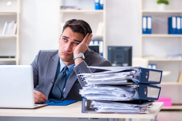 Overloaded with work employee under paperwork burden — Stock Photo, Image