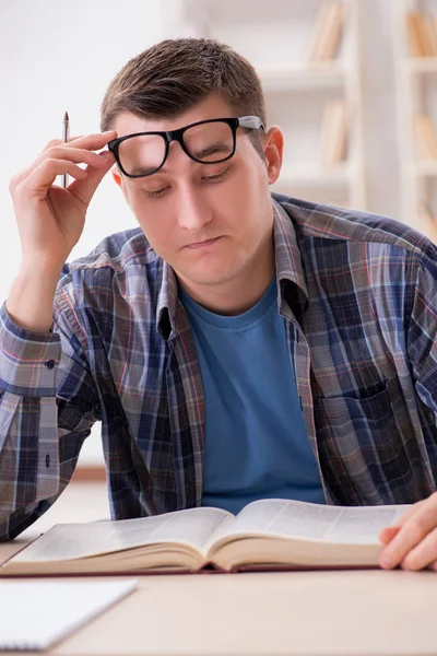 Young student preparing to school exams with books — Stock Photo, Image