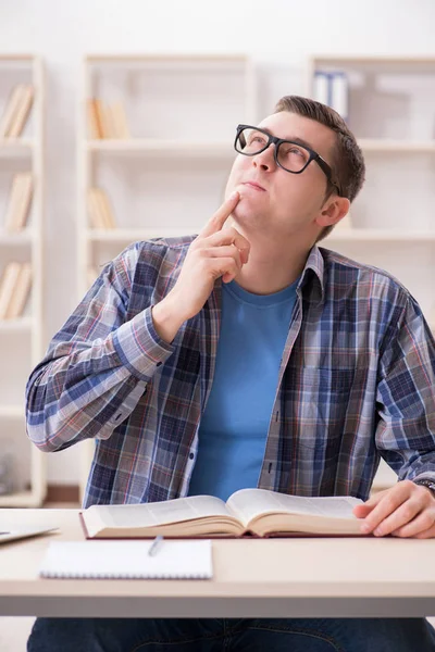 Young student preparing to school exams with books — Stock Photo, Image