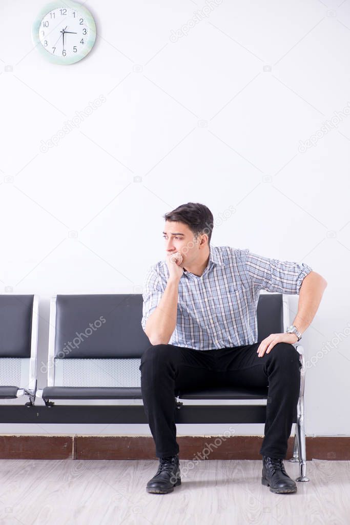 Man nervously impatiently waiting in the lobby