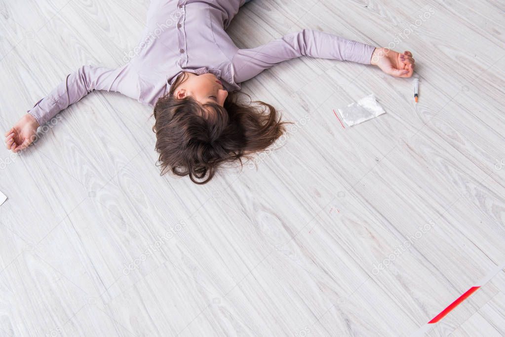 Dead woman on the floor after commiting suicide