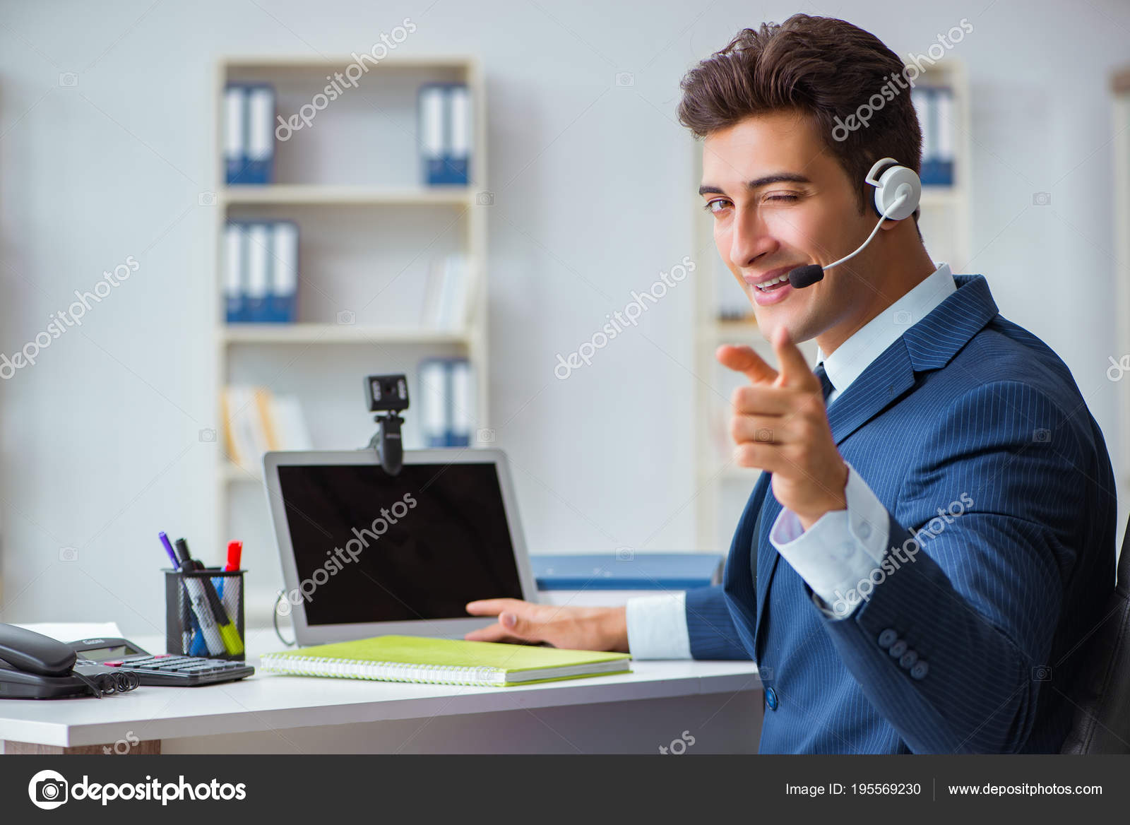 Young help desk operator working in office — Stock Photo © Elnur