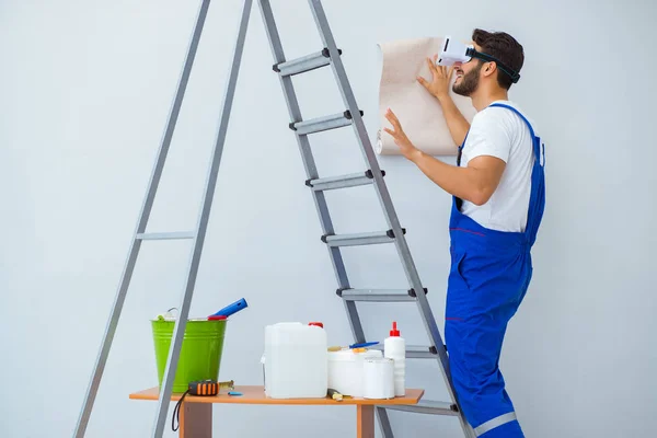 Man with VR glasses gluing wallpaper — Stock Photo, Image