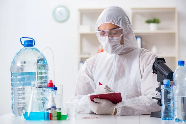 Lab assistant testing water quality