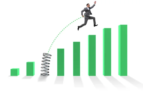 Business people jumping over bar charts — Stock Photo, Image