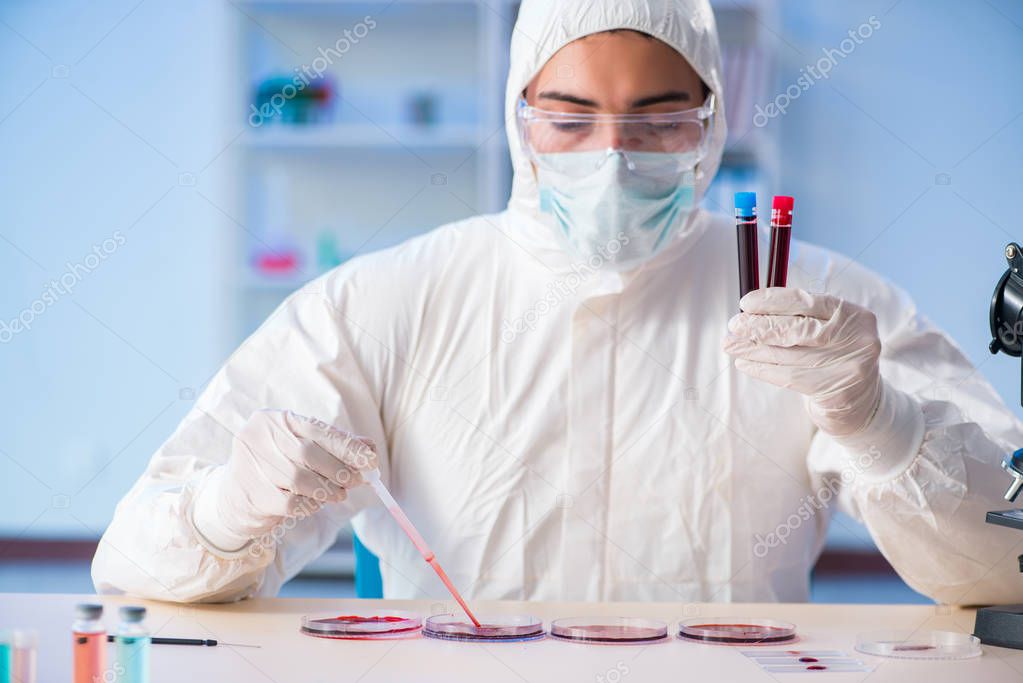 Lab assistant testing blood samples in hospital
