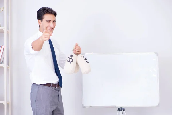 Businessman making presentation with money sacks — Stock Photo, Image