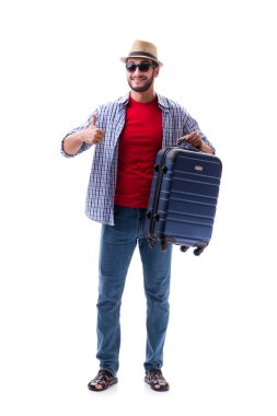 Genç adam yaz yolculuğuna hazır, beyazlar içinde.