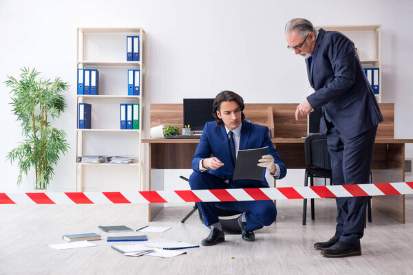 Two experts criminologists working in the office