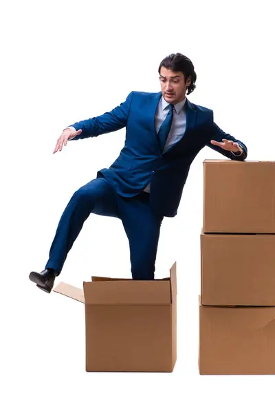 Young male employee with boxes isolated on white — Stock Photo, Image