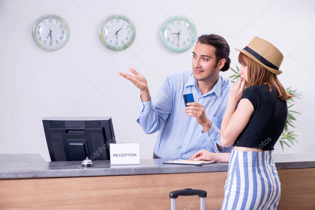 Young woman at hotel reception