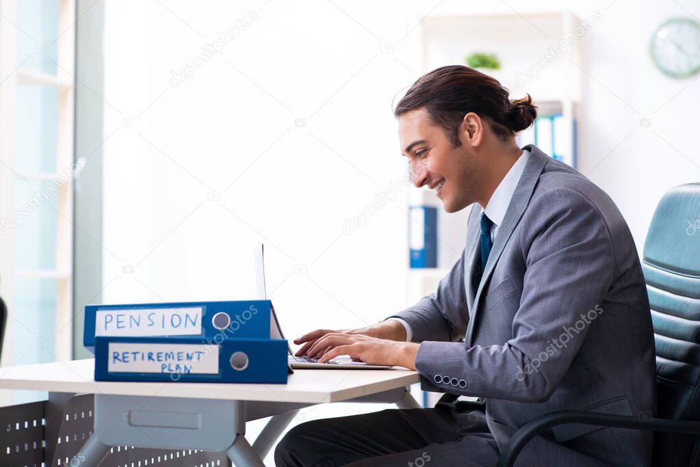 Young male accountant working in the office