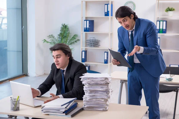 Two male colleagues unhappy with excessive work — Stock Photo, Image