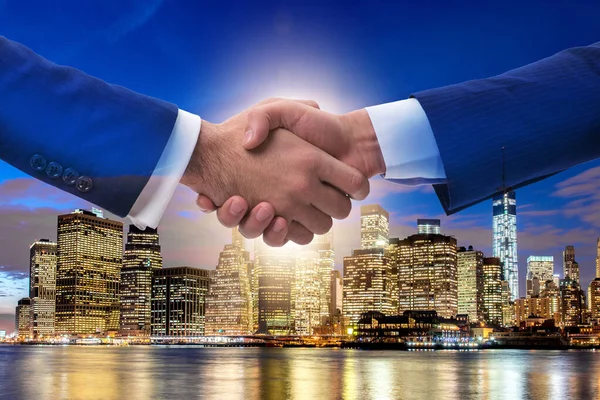 Businessman shaking hands in agreement — Stock Photo, Image