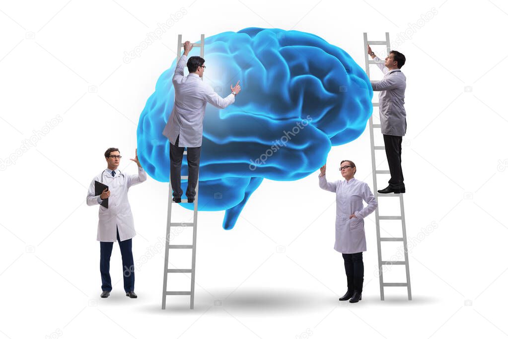 Team of doctors examining human brain