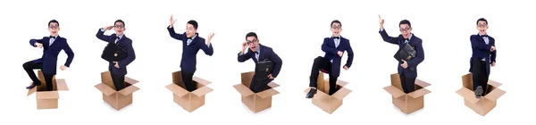 Businessman with box isolated on the white — Stock Photo, Image