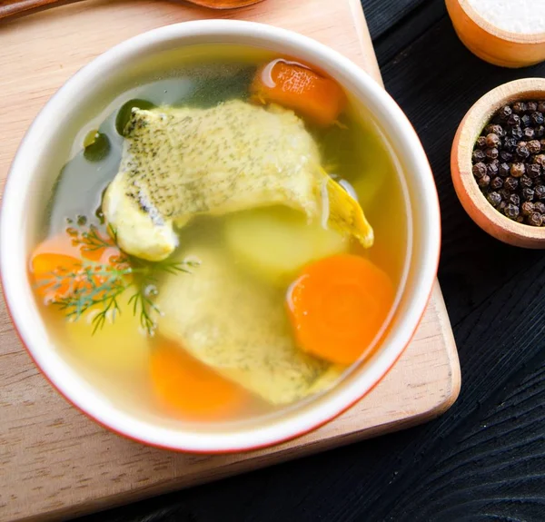 The fish soup served on the table in plate — Stock Image The fish soup served on the table in plate Royalty Free Stock Photos