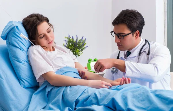 Doctor doing medical injection in hospital room