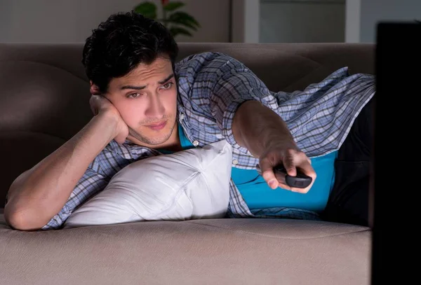 Young man watching tv late at night — Stock Photo, Image