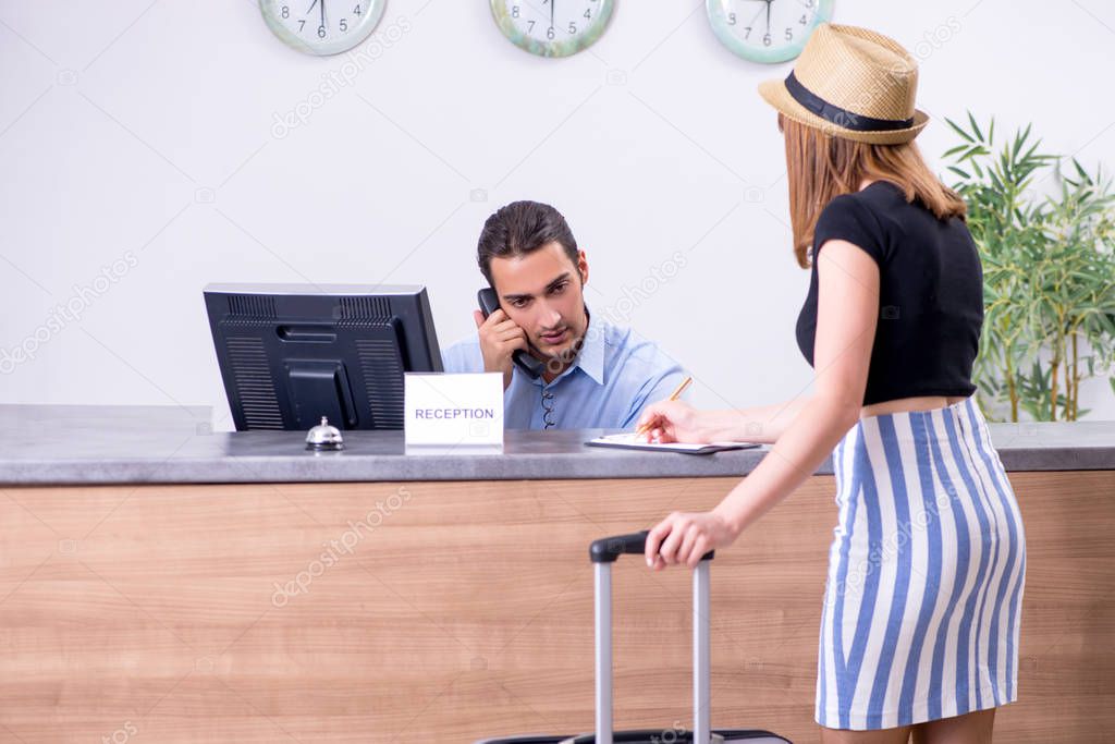 Young woman at hotel reception