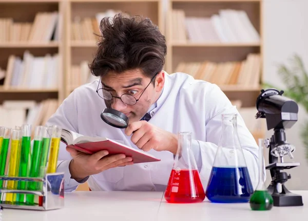 Mad crazy scientist doctor doing experiments in a laboratory